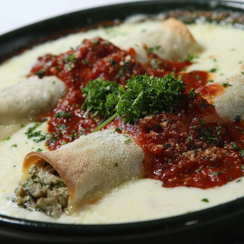 Vincent's Italian Cuisine signature dishes Corn and Crab Bisque in a Bread BowlVeal and Spinach Stuffed CanneloniOsso Buco